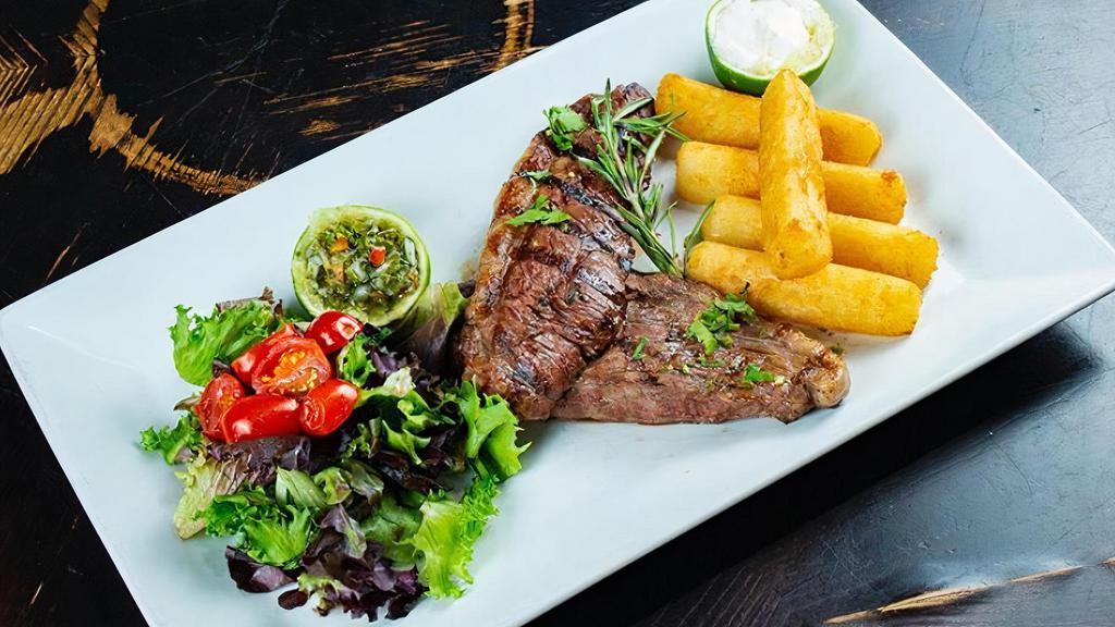 Picanha (Brasil) · Grilled top sirloin cap (coulotte) steak, yuca fries, mixed greens, Balsamic dressing salad, “chimichurri” and “creamy suero sauce