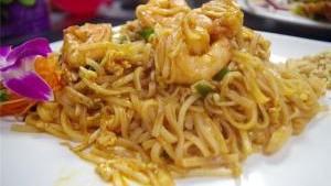 Pad Thai · Rice noodles stir-fried with egg, scallions bean sprout, and your choice of meat with lime a...