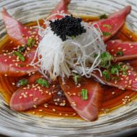 Tuna Tataki · Seared tuna, black tobiko, scallion served with ponzu sauce.