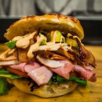 Club Chris · Freshly sliced turkey, sweet ham, smoked bacon, Swiss cheese, lettuce, tomato and our chipot...