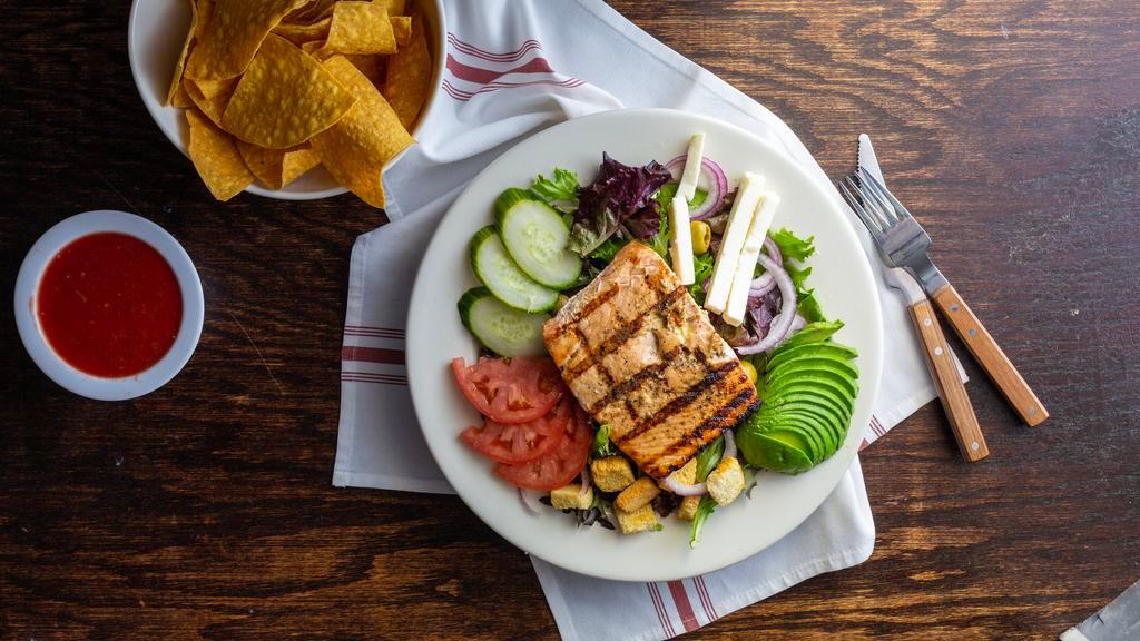 El Fogón Salad · Your choice of protein seated on a bed of lettuce, spring mix, avocado, cucumbers, tomatoes, red onions, queso fresco, green olives, croutons and your choice of dressing.