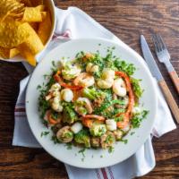 Tiradito Del Mar (New) · Grilled tilapia, scallops, shrimp, set on a bed of white rice topped with steamed veggies to...