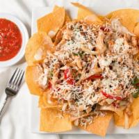 Fajita Nachos · House-made corn chips with queso, grilled bell peppers, and onions.
