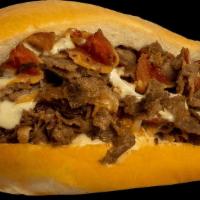#9 Bacon Cheesesteak · USDA Choice Grilled Steak, Bacon, Grilled Onions, & Swiss American Cheese.
