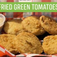 Fried Green Tomatoes · Hand sliced green tomatoes, lightly battered and fried to golden perfection.
