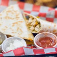 Chicken Quesadilla · Grilled or fried chicken, a blend of cheddar cheeses and salsa in a crispy toasted flour tor...