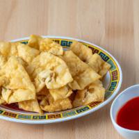 Wantán Frito (12) · Ground pork wrapped in wontons with tamarind sauce.