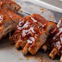 Bbq Pork Ribs · Served with baked beans, corn and cole slaw.