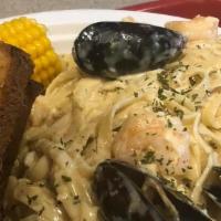 Seafood Alfredo · Seafood over a bed Linguine seasoned with Foxy’s Italian Seasoning and tossed in a Creamy Al...