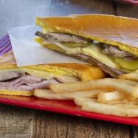 Medianoche · Pork, ham, swiss cheese, pickles and mayo on sweet bread