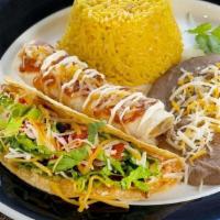 Taco & Enchilada Combination · One taco, soft or deep fried, and one enchilada with your choice of filling served with yell...