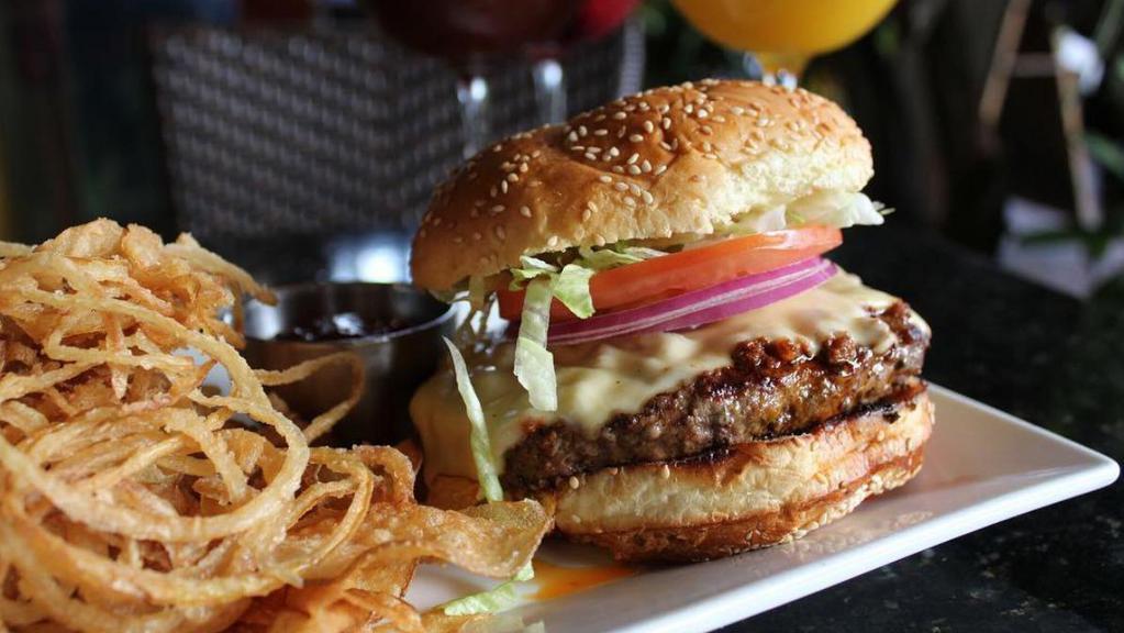 Cheeseburger · Beef, gouda cheese, lettuce, tomato, red onion, chipotle ketchup and french fries.