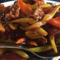 Beef Szechuan Style · Hot and spicy. Beef with carrots and celery in spicy sauce.