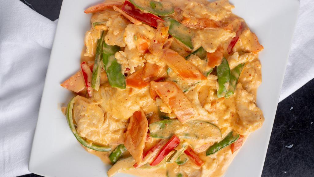 Panang Curry · Spicy. Sautéed bell pepper, carrot, fresh green beans & coconut milk in a homemade panang curry.
