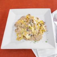 Papardelle Del Nord · Wide pappardelle noodles served with a creamy porcini meat sauce