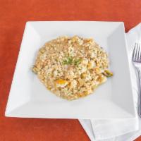 Seafood Risotto · Italian Arborio risotto served with an array of shrimp, scallops, mussels & clams