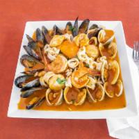 Zuppa Di Pesce · Salmon, over-sized shrimp, calamari, scallops, mussels, little neck clams Sautéed in a tomat...