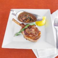 Veal Chop 14Oz · Roasted 14 oz veal chop seasoned with shallots & flambéed In a brandy & Marsala wine sauce w...