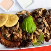 Picada Doña Arepa (2 Personas) · Grilled beef chunks, chicken, fried pork, crackling pork, avocado marinated in our special m...