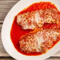 Chicken Parmigiana · With tomato sauce and mozzarella.