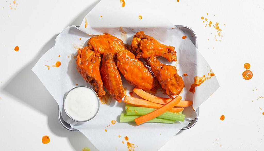 Bone-In Chicken Wings (6) · 6 bone-in chicken wings with your choice of sauce. Served with celery and blue cheese or ranch.