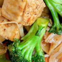 Pad See-U · Gluten-Free. Pad see-u stir-fried rice noodles, broccoli, carrots, and cabbage in a homemade...