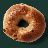 Cinnamon Raisin Bagel · Soft, chewy and thick New York–style bagel swirled with sweet cinnamon and raisins. Availabl...