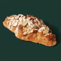 Almond Croissant · Our rich, almond flan enveloped in a flaky, buttery croissant, then topped with sliced almon...