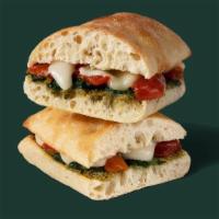 Tomato & Mozzarella On Focaccia · Roasted tomatoes, mozzarella, spinach and basil pesto layered on toasted focaccia bread. - V...
