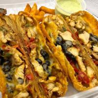 All Fajita Eggrolls · Grilled chicken, black beans, sauteed peppers, onions and Mexican cheese. Two per order.