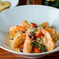 Shrimp Saganaki · Sautéed shrimp with garlic, cherry tomatoes, kalamata olives, feta cheese, and served with h...