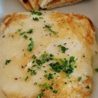 Cheese Saganaki · Greek kefalograviera cheese, seared in extra virgin olive oil, topped off with fresh lemon j...