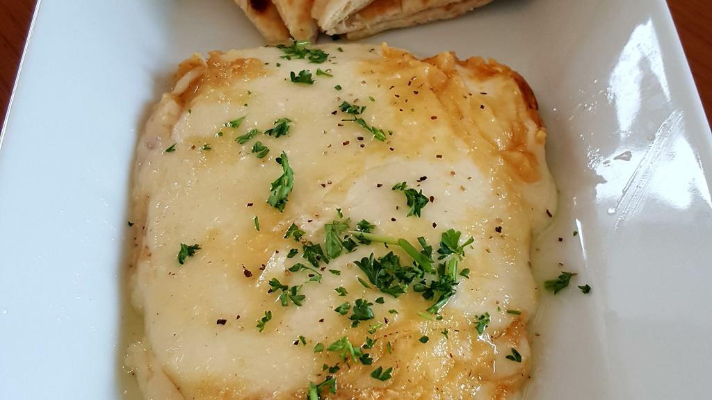 Cheese Saganaki · Greek kefalograviera cheese, seared in extra virgin olive oil, topped off with fresh lemon juice, and served with hot pita bread.