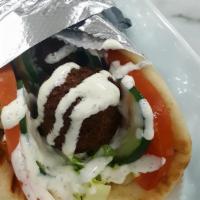 Falafel Pita Wrap · Choice of wheat or white pita bread, tomatoes, cucumbers, lettuce, a few fries and our homem...