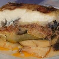 Moussaka · Sliced Eggplant and potatoes, layered with seasoned ground beef and topped with a creamy bec...