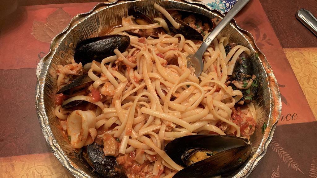 Seafood Feast · Shrimp, clams, mussels, calamari w/ homemade seafood sauce.