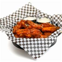 6 Wings · 6 traditional bone-in wings tossed in your choice of wing sauce.