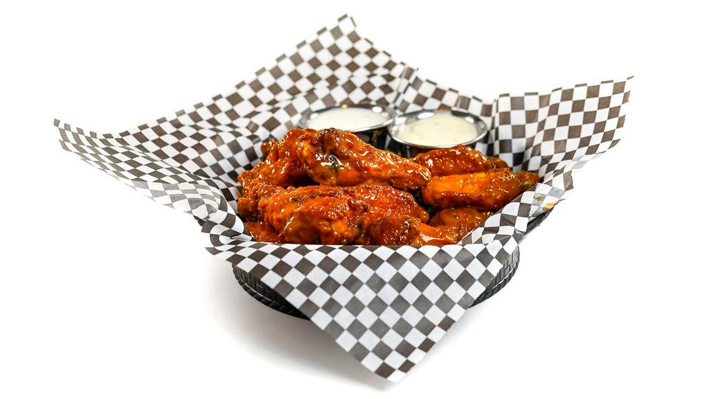 18 Wings · 18 traditional bone-in wings tossed in your choice of wing sauce.