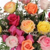 Classic Dozen Rainbow Of Roses  · Share the colors of the rainbow with this stunning bouquet! With gorgeous yellow, peach, red...