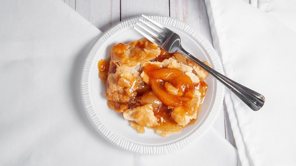 Peach Cobbler · Fresh peaches over crispy crust and juices--served warm.