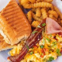  Breakfast Combo  · Scrambles Or Fry Eggs, Ham & Bacon , Toast Including a Coffe Or  Can Juice Or Soda