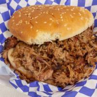 Pulled Pork Sandwich · Slow smoked pork shoulder, cooked to the perfection of taste and tenderness.