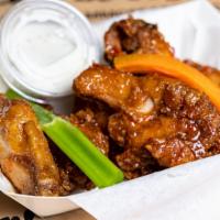 Chicken Wings · Marinated in our special Mr. and Mrs. crab seasoning naked or breaded, tossed with your choi...