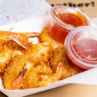 Coconut Shrimp · Battered with coconut shavings, deep fried, served with our sweet Thai chill and cocktail sa...