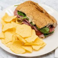 Genoa Salami (Half) · Fresh sliced Genoa salami with your choice of bread or wrap, cheese, condiments, and toppings.