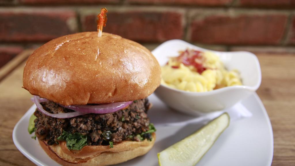 Blackbean Burger · The Best Black Bean Burger in the ATL!! Homemade!  Topped with chipotle mayo and lettuce, tomato and onion.  Served on a Challah bun.