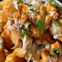 Buffalo Chicken Totchos · Tots smothered with grilled chicken in our spicy buffalo sauce, blue cheese dressing and top...