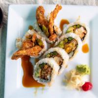 Spider Roll · Soft shell crab, avocado, asparagus, scallion, and sesame seeds, drizzled with eel sauce.