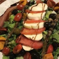 Caprese Salad · Mozzarella, tomatoes, arugula, cherries tomatoes, olive, prosciutto and pesto.
