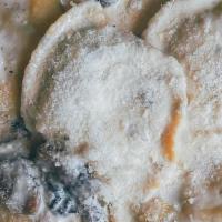 Spinach-Ricotta Ravioli · Homemade ravioli filled with ricotta, goat and feta cheese, parsley flakes and spices. Serve...